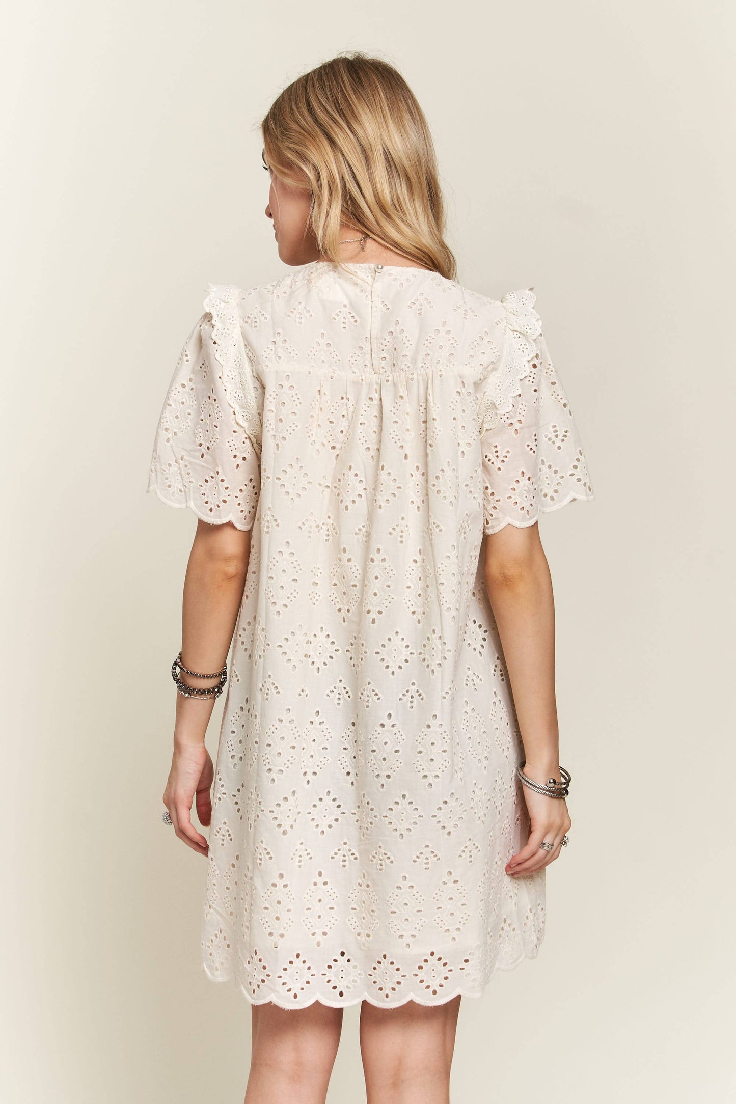 Ruffle shoulder eyelet dress