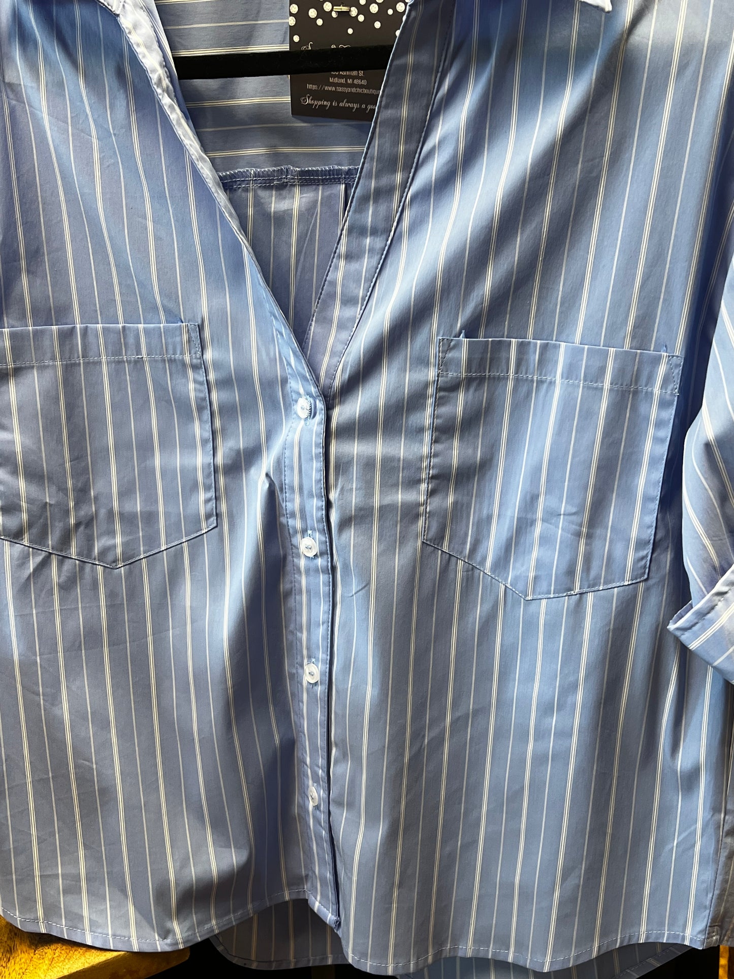 Light blue and white button down top